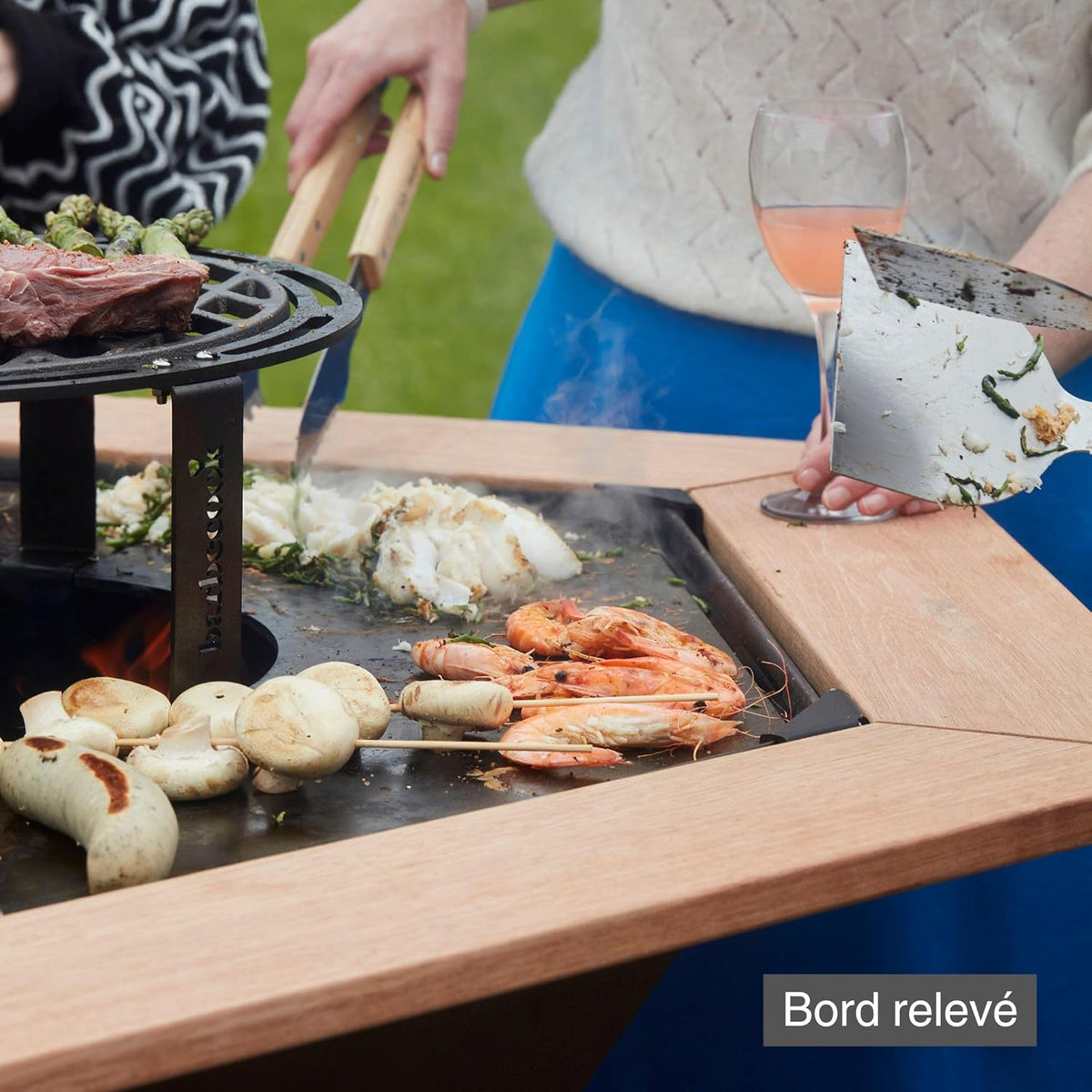 Barbacoa brasero Barbecook Nestor Original, barbacoa de leña para exteriores con plancha, mesas auxiliares y parrilla elevada de acero corten, 128x120x120cm