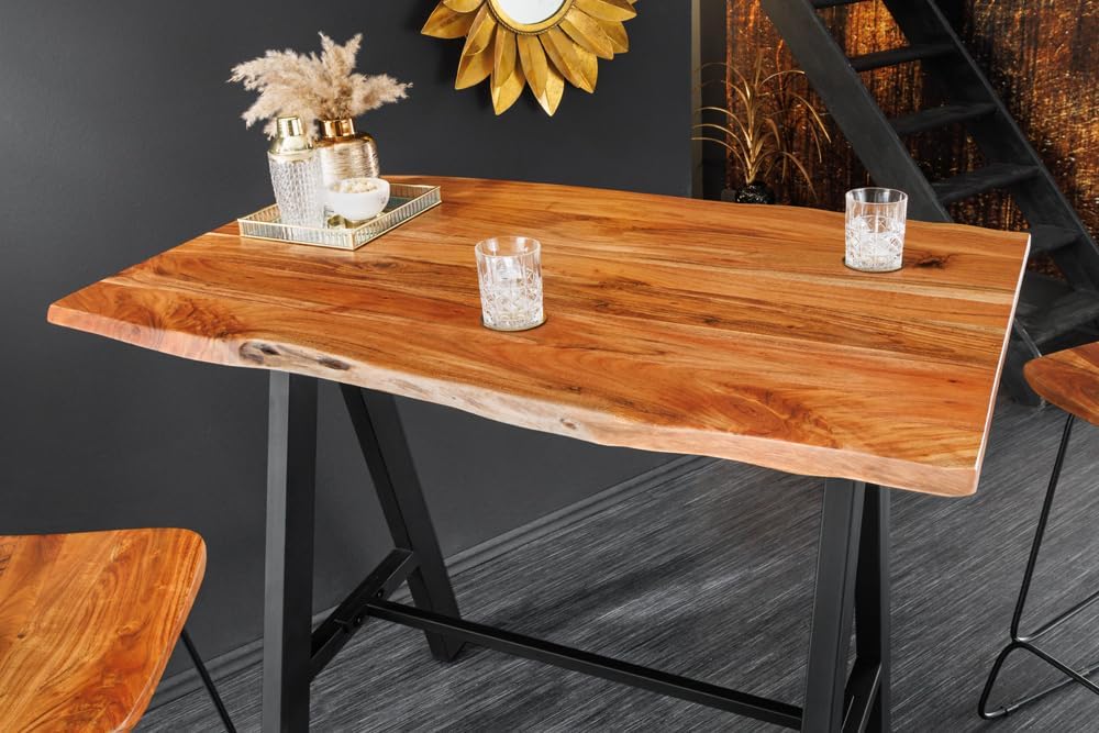 Mesa de bar de madera maciza Riess Ambiente Mammut 120 cm, acacia natural con borde vivo, metal negro con reposapiés, mesa de cocina, mostrador de cocina, mesa alta rectangular