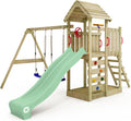 Torre de juegos WICKEY MultiFlyer con tejado de madera, columpio y tobogán verde pastel, torre de escalada para niños al aire libre con arenero, escalera y accesorios de juego para el jardín