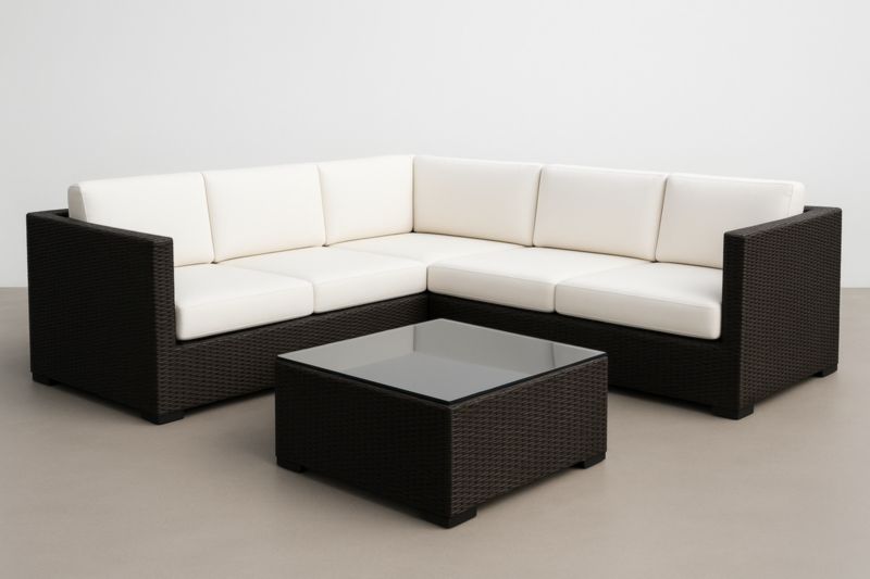 Conjunto de esquina para salón de exterior de resina trenzada con cojines y mesa de centro de cristal