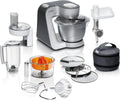 Procesador de alimentos Bosch Serie 4 MUM56340, bol de 3,9 L, batidora de 1,25 L, picadora de carne, exprimidor, sistema de mezclado planetario, gancho para amasar, varillas batidoras y mezcladoras, cortador-rallador, 3 discos, 900 W, plata/gris