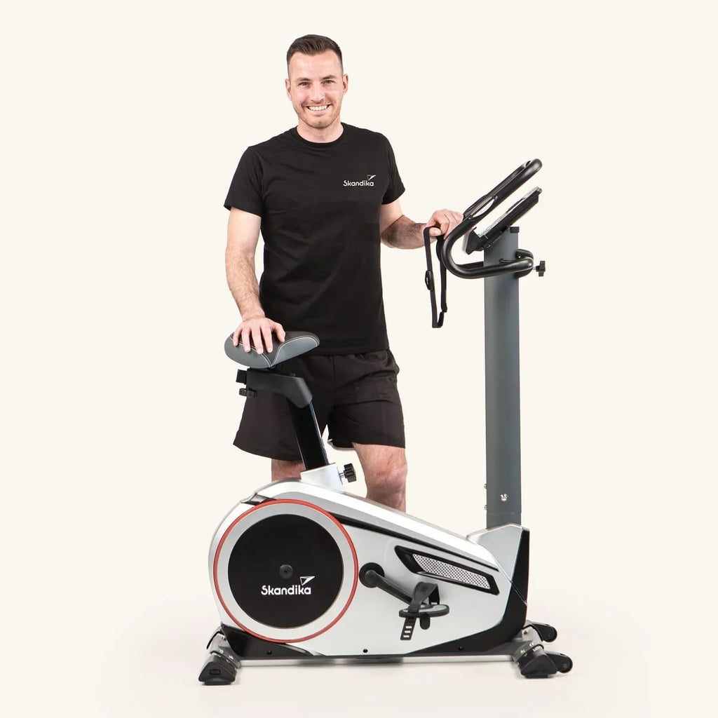 Bicicleta estática ergométrica Morpheus, sistema de freno magnético, 12 kg de masa de inercia, 32 niveles, 24 programas, compatible con la aplicación Kinomap, 150 kg, 144x56x103 cm
