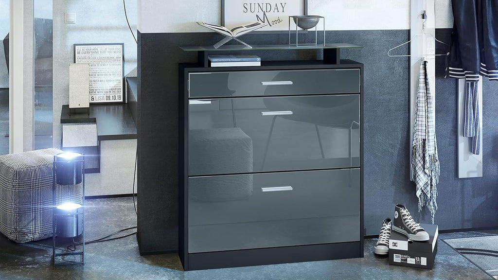 Zapatero Vladon Loret, mueble basculante para 16 pares de zapatos con 2 puertas abatibles, 1 cajón y estante de cristal, negro mate/gris alto brillo (89 x 104 x 23 cm)